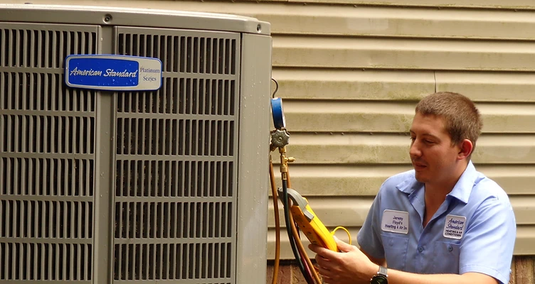 Floyd's technician installing an American Standard system in Spartanburg, SC