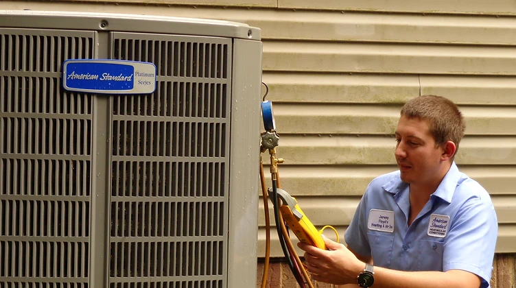 Floyd's HVAC technician diagnosing an American Standard condenser in Spartanburg, SC