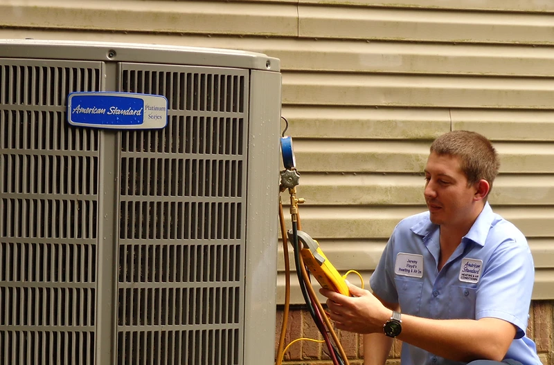 Floyd's Heating & Air technician servicing residential HVAC equipment in Spartanburg, SC