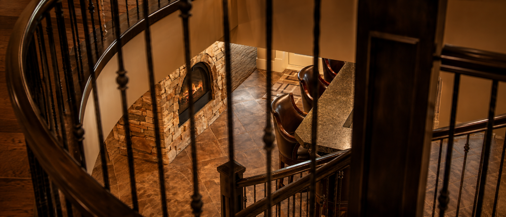 Custom spiral staircase with wrought iron balusters