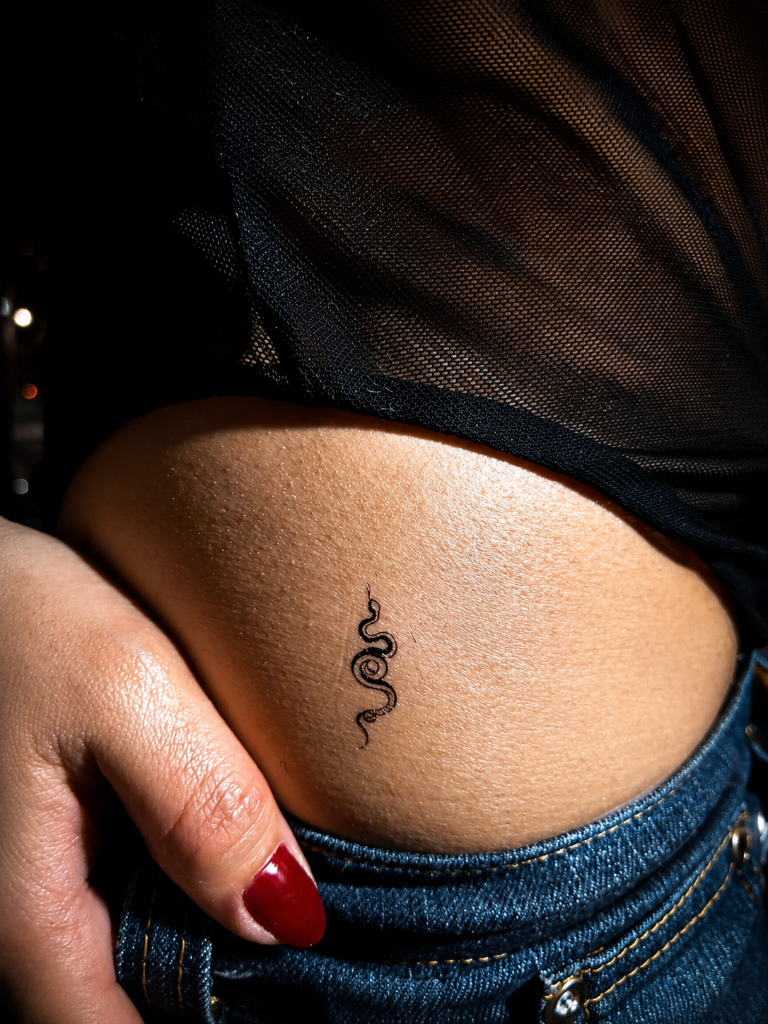 Snake hip tattoo