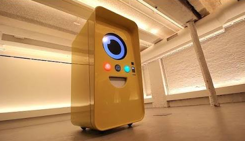 Snapchat Spectacles yellow vending machine in a white-walled gallery space