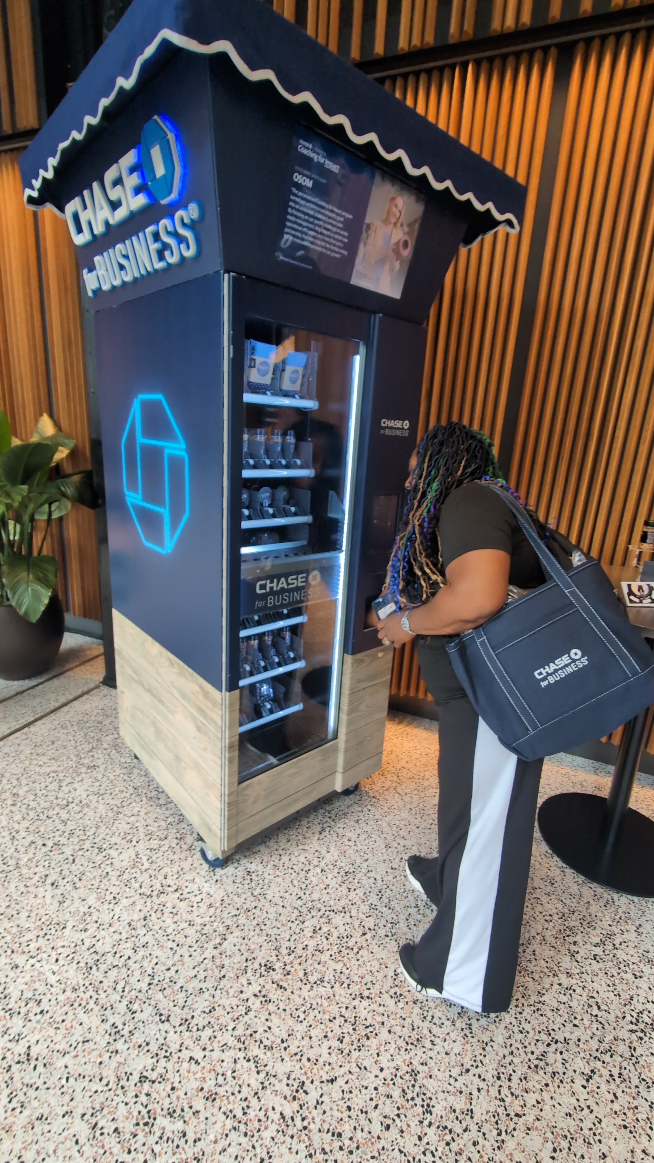 JPMorgan Chase for Business custom interactive vending machine with blue lighting at an event