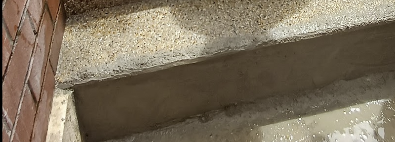Repaired cracked pebblecrete step