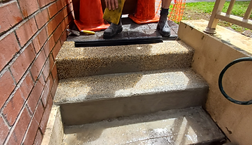 Repaired pebblecrete step