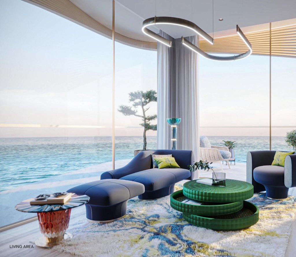 Jacob & Co. Residences living area with panoramic sea view and curved glass facade