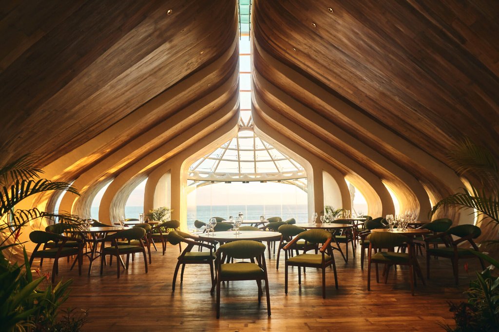 Luna Beach Club — bamboo architecture dining room at sunset over the ocean