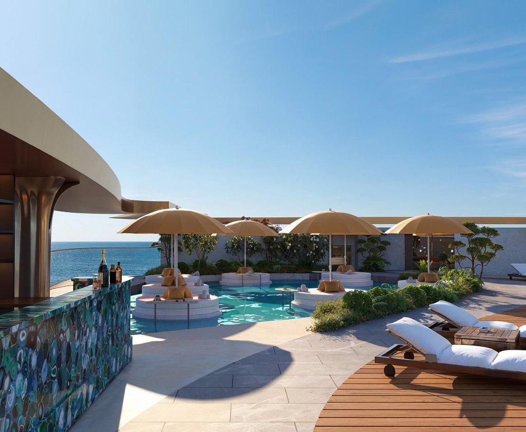 Jacob & Co. Residences rooftop pool bar and cabanas facing the Arabian Gulf