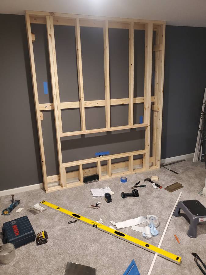 Shiplap fireplace wall construction in progress — north metro home improvement
