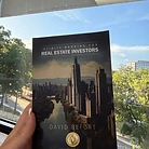 Reader holding the book
