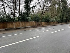 Lap panel fence with concrete posts and gravel board
