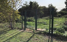 Commercial metal rail fence on a business site