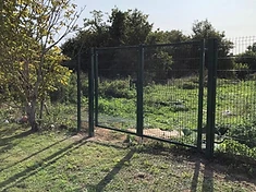 Commercial metal rail fence on a business site