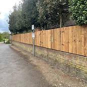 Closeboard fence installed along a road in Surrey