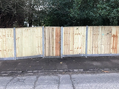 Lap panel fence with concrete posts installed in Surrey