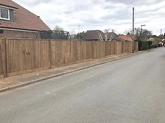 Dark vertical lap panel fence