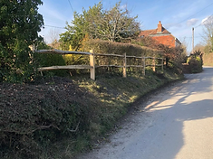 Rustic wooden picket fence in Dorking