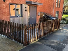 Dark wood picket fence installed in Surrey
