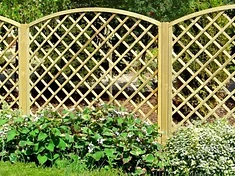 Garden trellis fence panels fitted above a closeboard fence