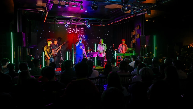 GAME ON performing to a full room in Brisbane