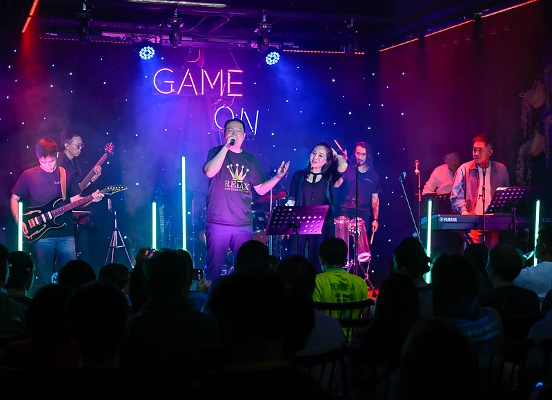 GAME ON band photographed together on stage
