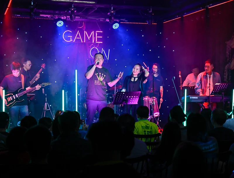 The GAME ON band performing together on stage