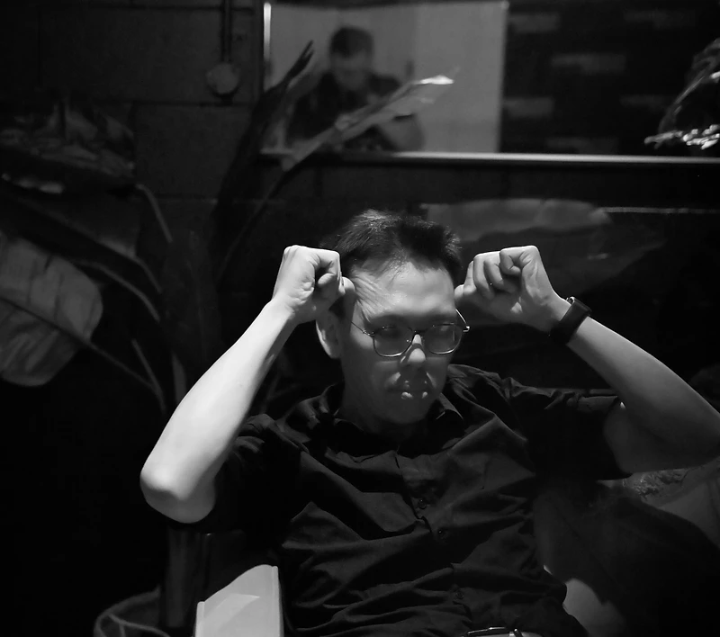 Black and white backstage portrait of a GAME ON member