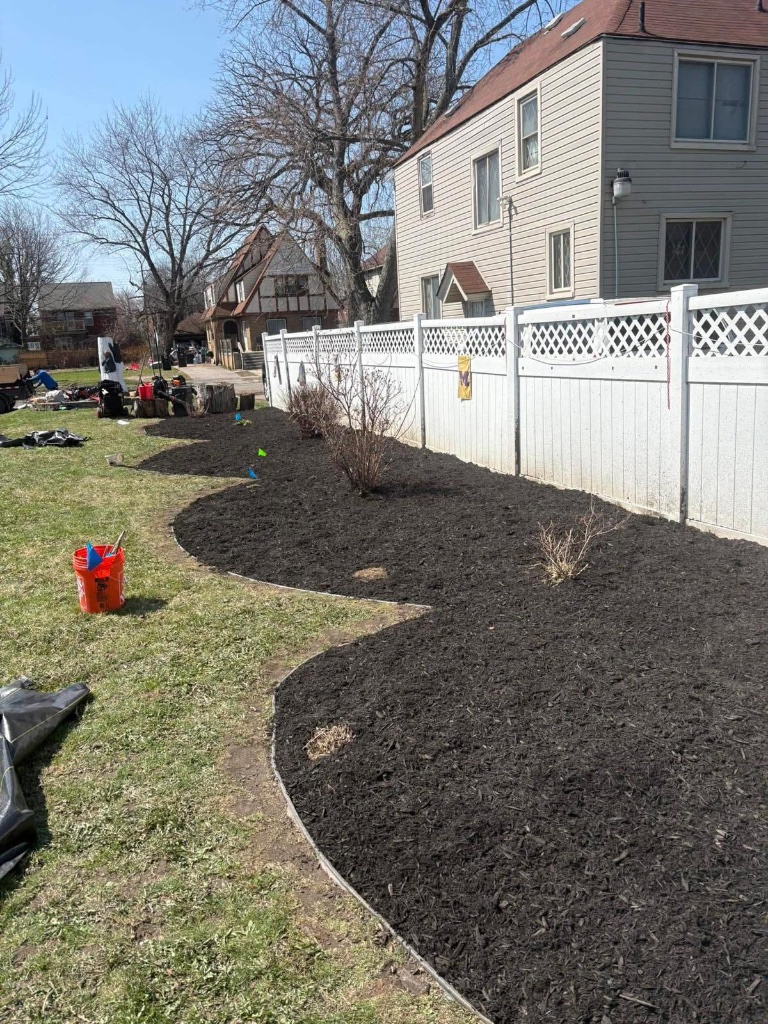 Brick edging and fresh mulch beds in Grosse Pointe Farms
