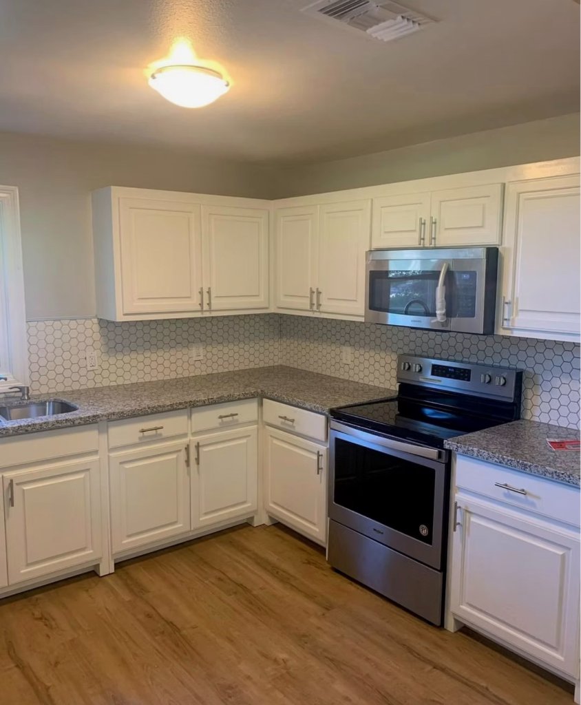 Kitchen Renovation — Granite & White Cabinets