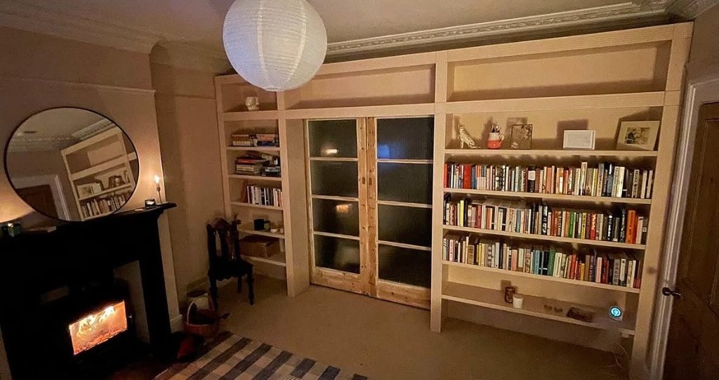 Bespoke built-in bookshelf and room divider by Cotham Carpentry