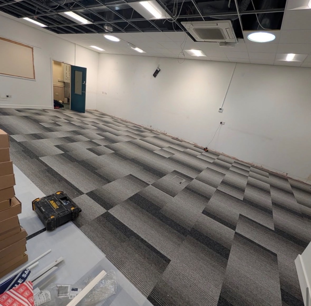 Commercial carpet tile installation in a large office space