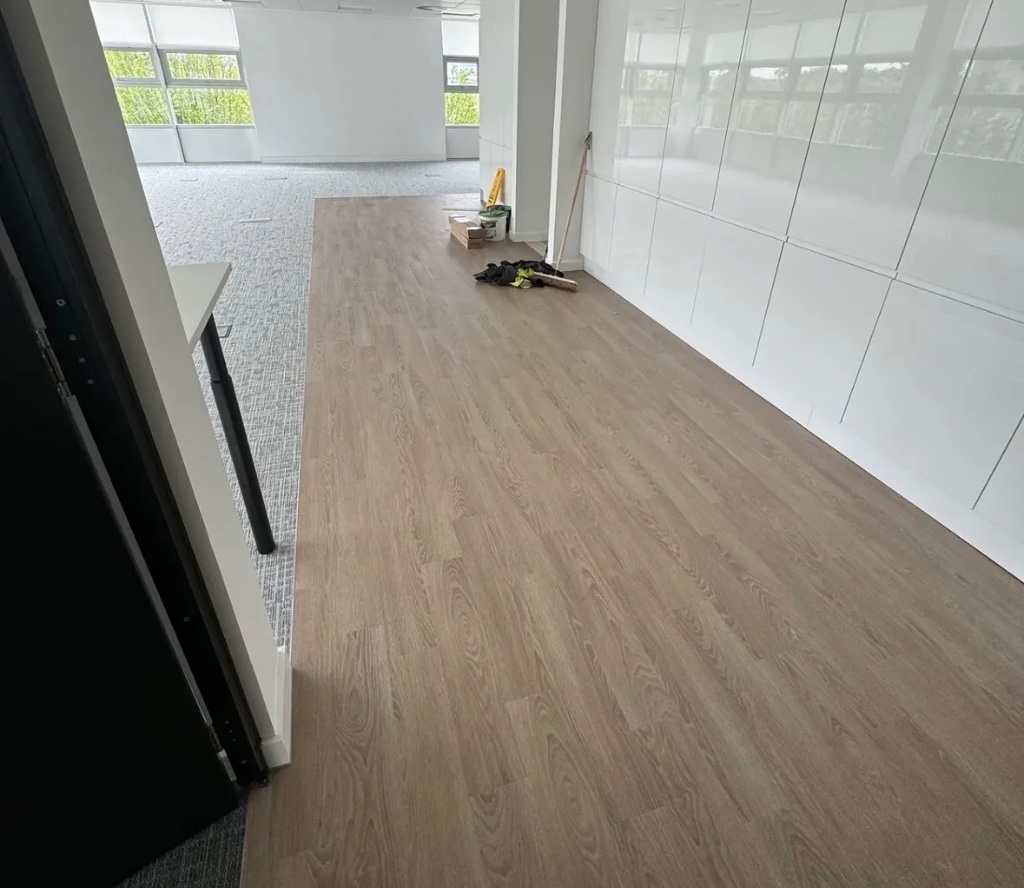 LVT plank flooring in commercial office with glass partitions