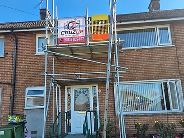 Front facade scaffold with safety gate