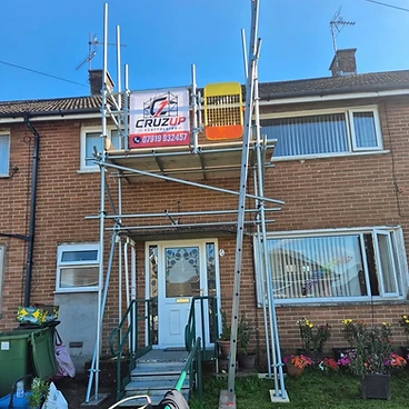 Front facade scaffold with safety gate