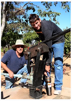 Joshua and Bruce installing solar panels