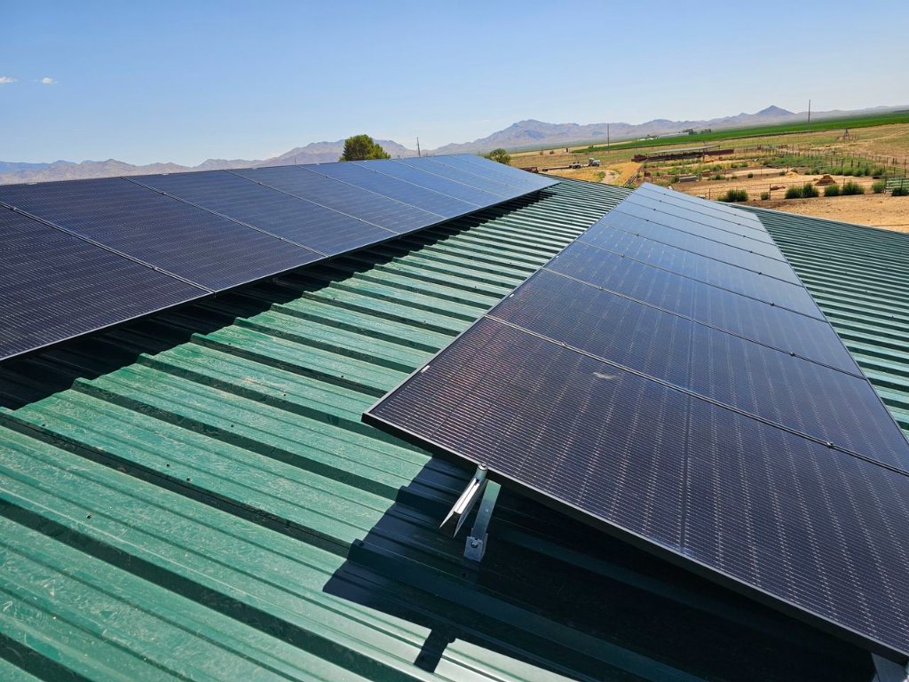 Solar panels on green metal roof