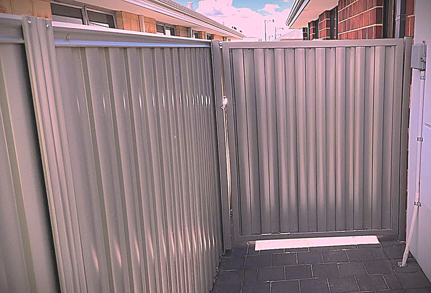 Charcoal grey aluminium corrugated side gate and matching fence panel