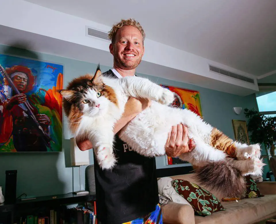 Jon holding King Samson, the 28-pound Maine Coon