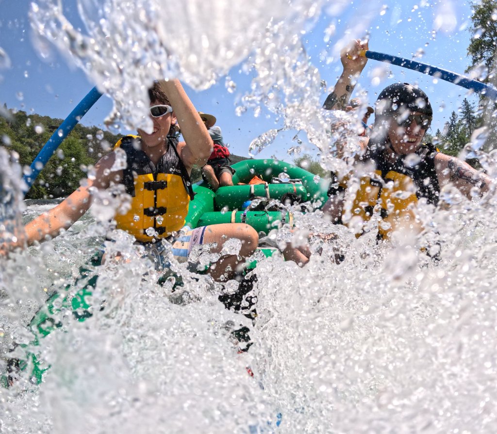 Rafters splashing through whitewater rapids on the Rogue River
