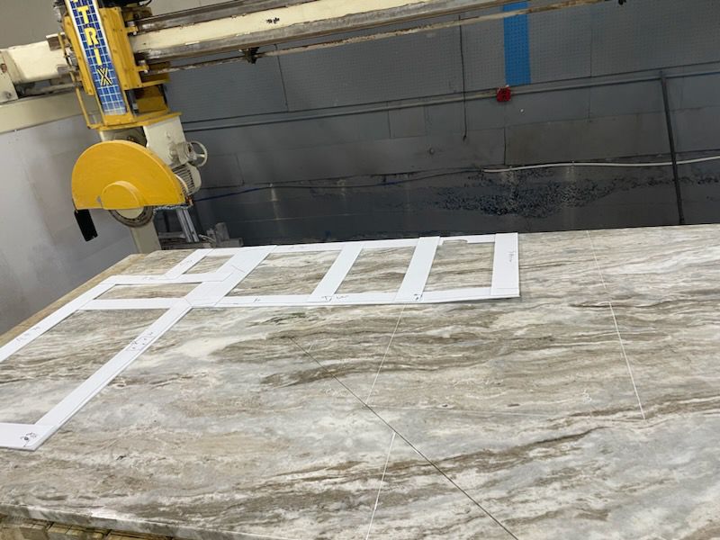 Stone slab fabrication cutting at Schenectady Marble and Granite workshop