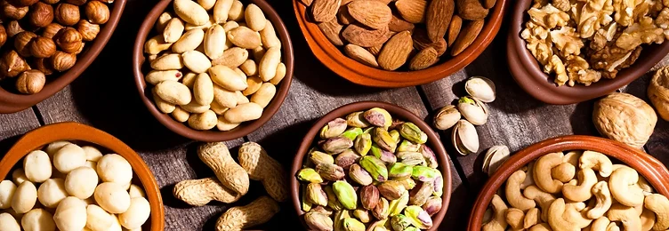 Assorted nuts and seeds in bowls