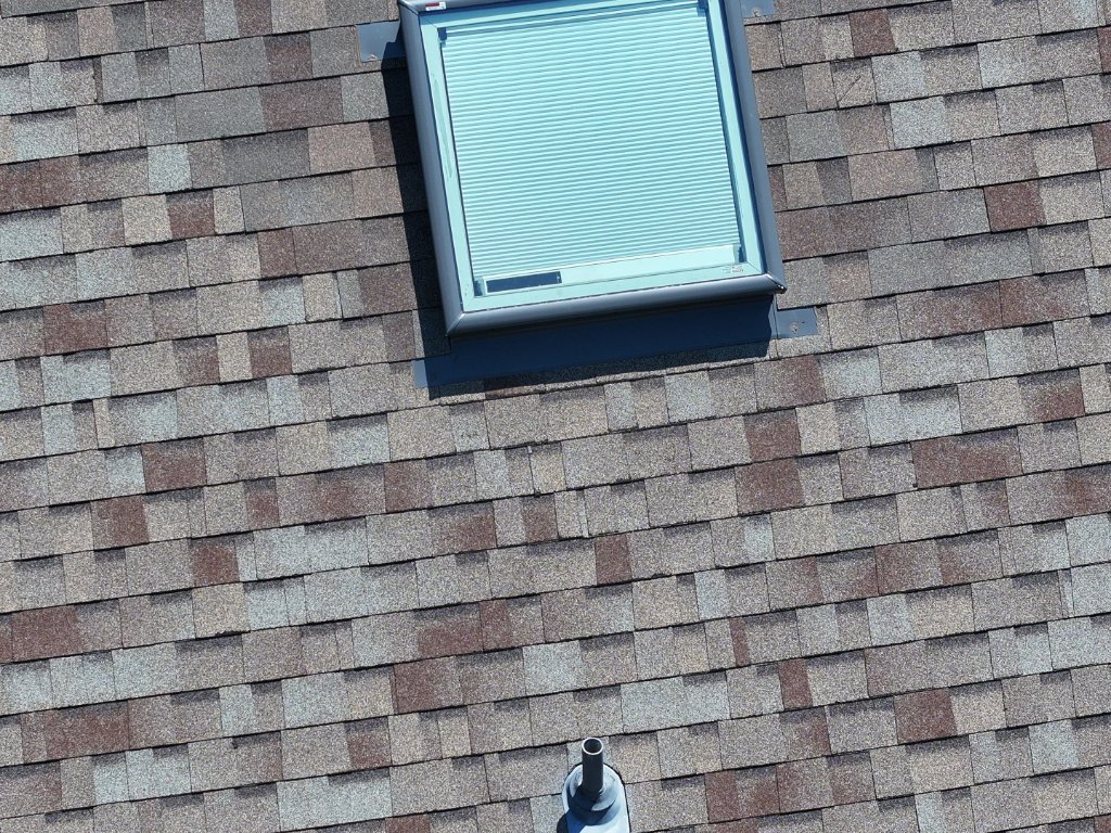 Skylight Flashing Detail on a Bedford Shingle Roof - Bedford Roofing project photo by Becker Roofing and Exteriors