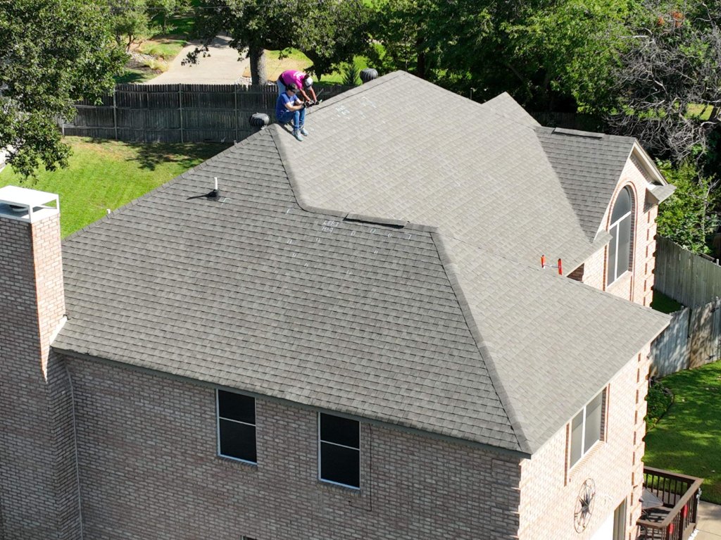 Becker Roofing Inspector on a Bedford Residential Roof - Bedford Roofing project photo by Becker Roofing and Exteriors