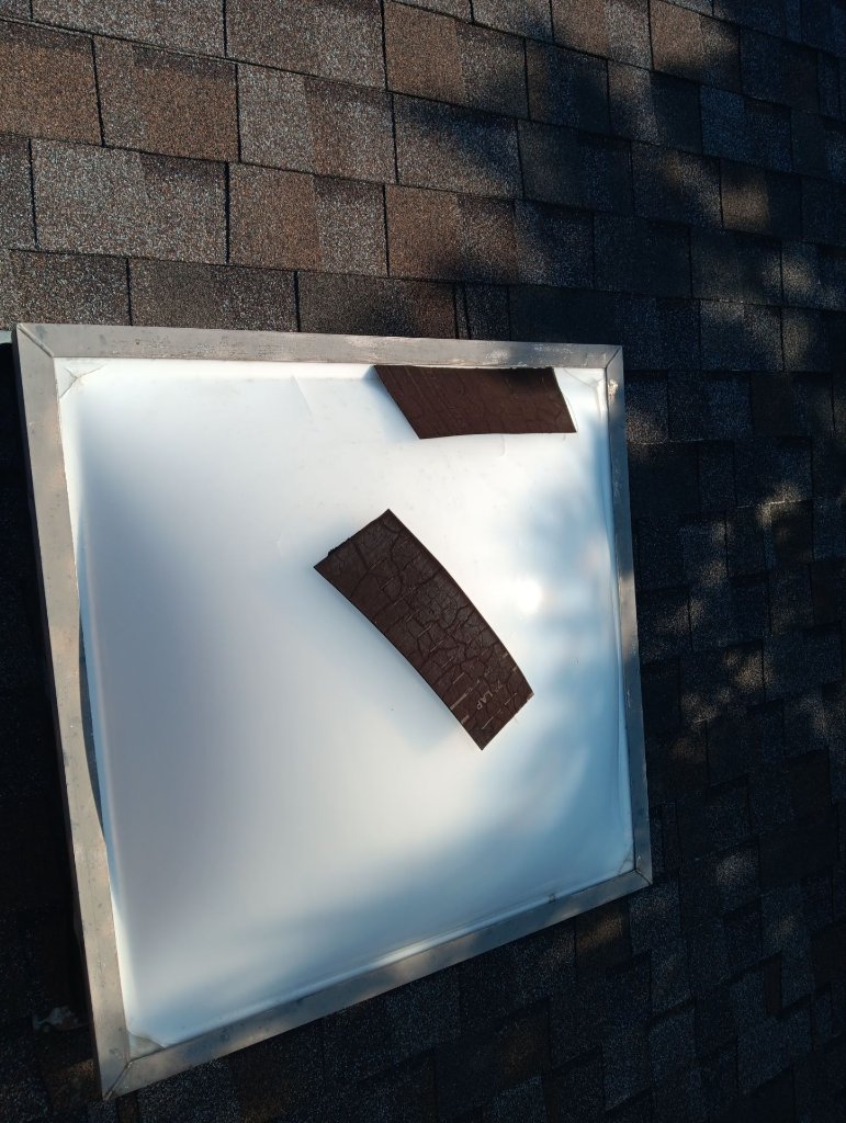 Bedford Skylight Storm Damage Shingle Debris Becker Roofing - Bedford Roofing project photo by Becker Roofing and Exteriors