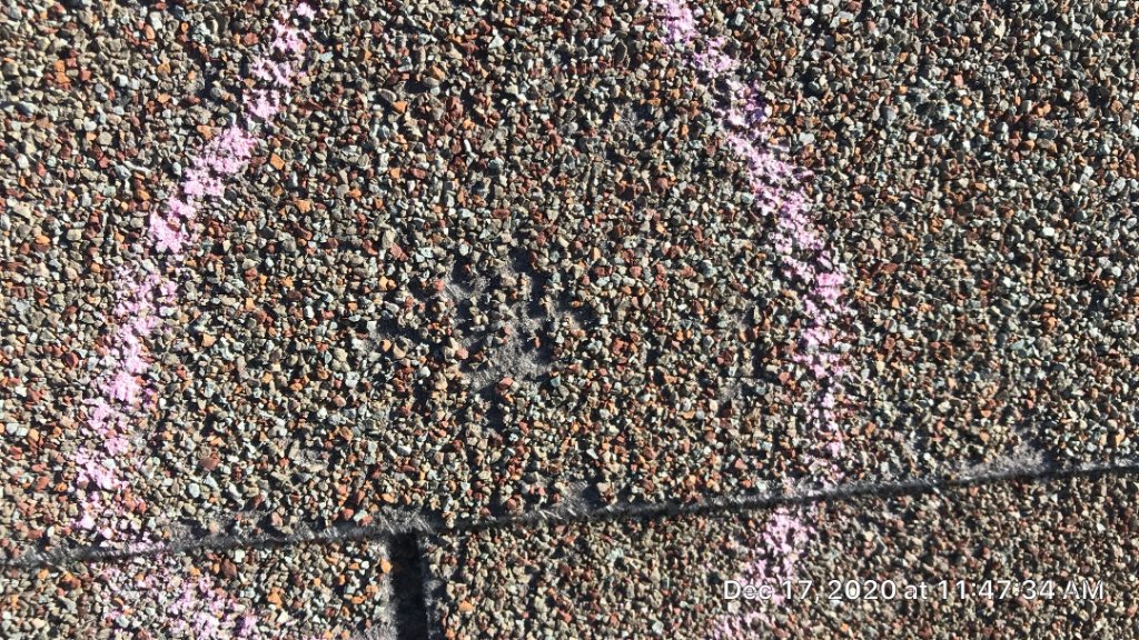 Hail Damage Shingle Bruise Marked With Pink Chalk in Bedford - Bedford Roofing project photo by Becker Roofing and Exteriors