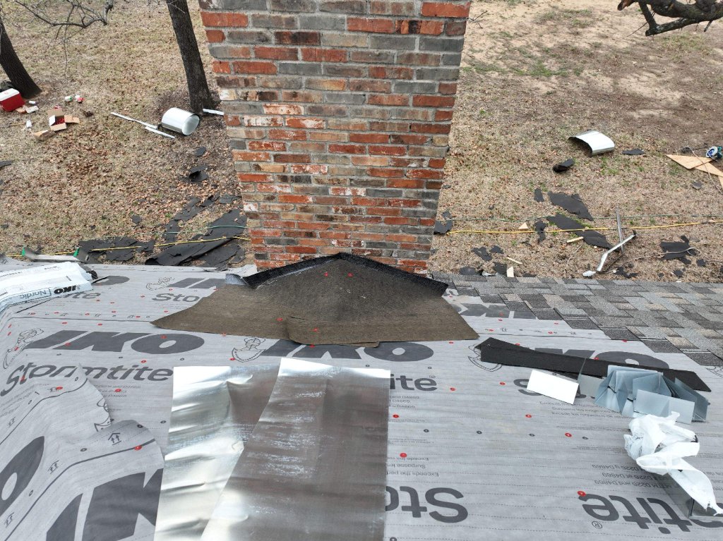 Southlake Texas Roof Replacement Chimney Cricket Addedtomeet Building Codes - Southlake Roofing project photo by Becker Roofing and Exteriors