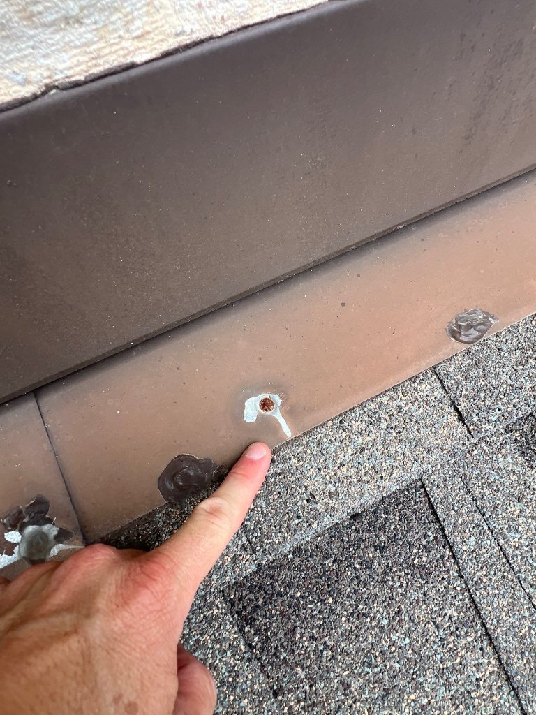 Frisco Texas Roof Flashing Repairedby Caulking Exposed Nails - Roof Repair project photo by Becker Roofing and Exteriors