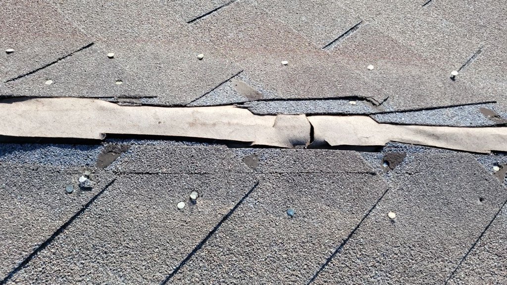 Roanoke Cracked Failed Ridge Shingle Weather Damage Becker Roofing - Roanoke Roofing project photo by Becker Roofing and Exteriors