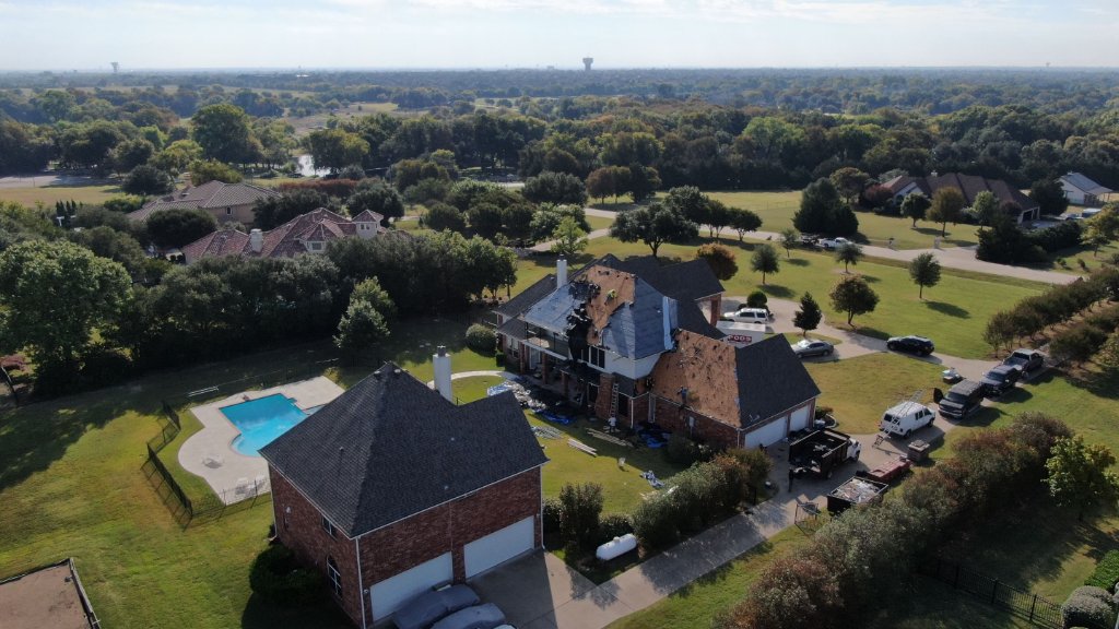 Allen Texas Repairafter40foot Tall Chimney Fellinto House Replaced Two Slopesofthe Roofingand Decking During Photo - Roof Repair project photo by Becker Roofing and Exteriors