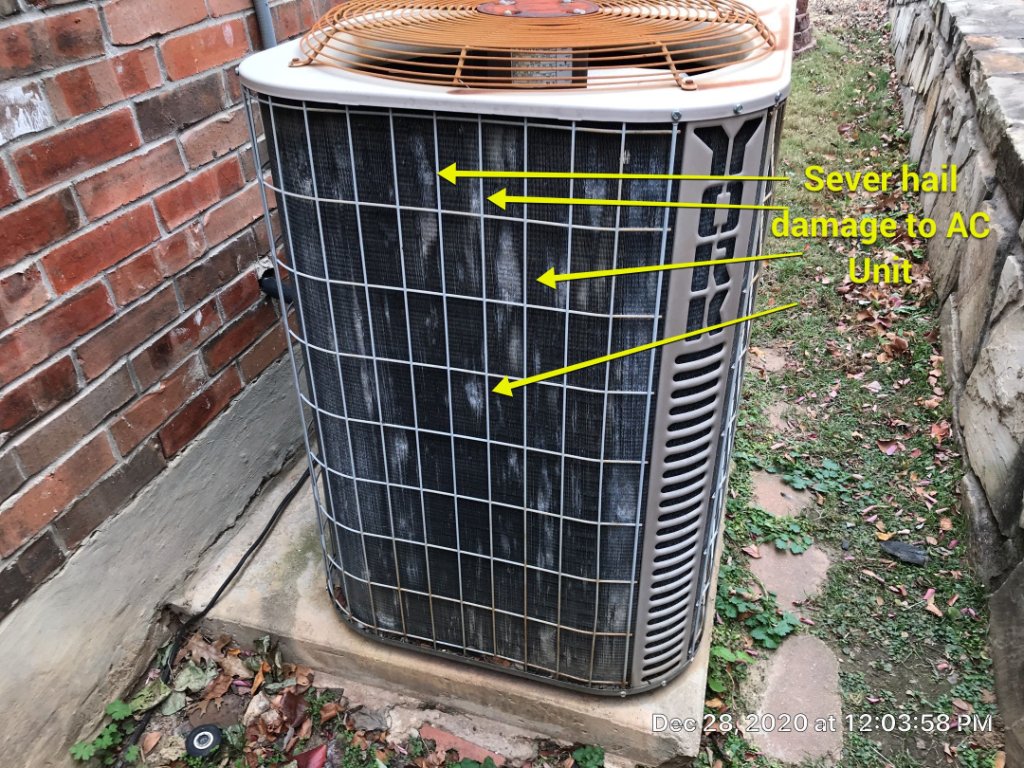 Severe Hail Damage to an AC Condenser Unit in Bedford - Bedford Roofing project photo by Becker Roofing and Exteriors